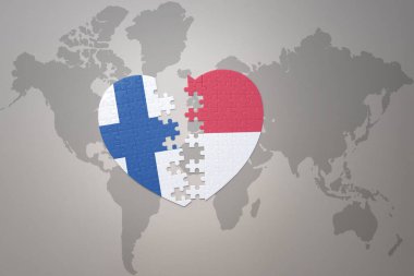 Endonezya ulusal bayrağı ve Finlandiya 'nın bulmaca kalbi dünya haritası arka planında. Kavram. 3B illüstrasyon