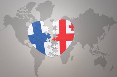 Dünya haritasında, Gürcistan ve Finlandiya 'nın ulusal bayrağı olan bir yapboz kalp. Kavram. 3B illüstrasyon