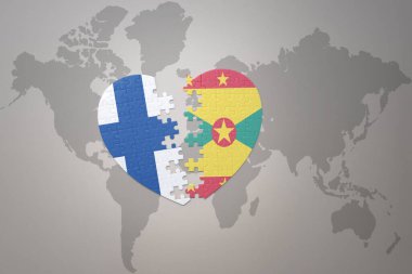 Dünya haritasının arka planında Grenada ve Finlandiya 'nın ulusal bayrağı olan bir yapboz kalp. Kavram. 3B illüstrasyon