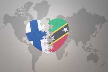 Dünya haritasında Aziz Kitts, Nevis ve Finlandiya 'nın ulusal bayrağını taşıyan bir bulmaca kalbi. Kavram. 3B illüstrasyon