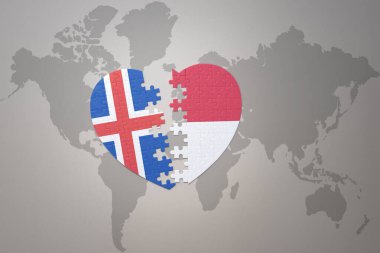 Endonezya ve İzlanda 'nın ulusal bayrağını taşıyan bir yapboz kalbi dünya haritasının arka planında. Kavram. 3B illüstrasyon
