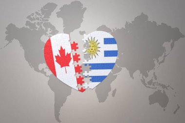 Kanada ve Uruguay 'ın ulusal bayrağını bir dünya haritasında bulmaca kalbi. Konsept. 3B illüstrasyon