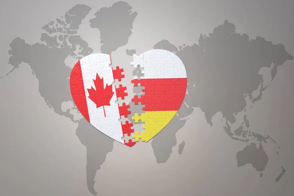 Puzzleherz Mit Der Nationalflagge Kanadas Und Südossetiens Auf Einer Weltkarte — Stockfoto