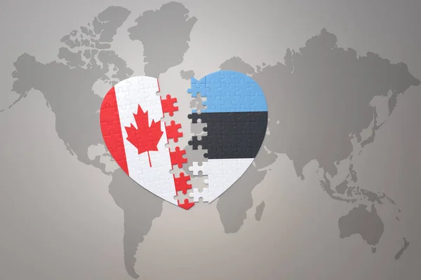 Puzzleherz Mit Der Nationalflagge Kanadas Und Estlands Auf Einer Weltkarte — Stockfoto