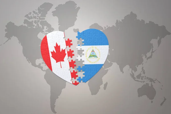 Puzzle Herz Mit Der Nationalflagge Von Kanada Und Nicaragua Auf — Stockfoto