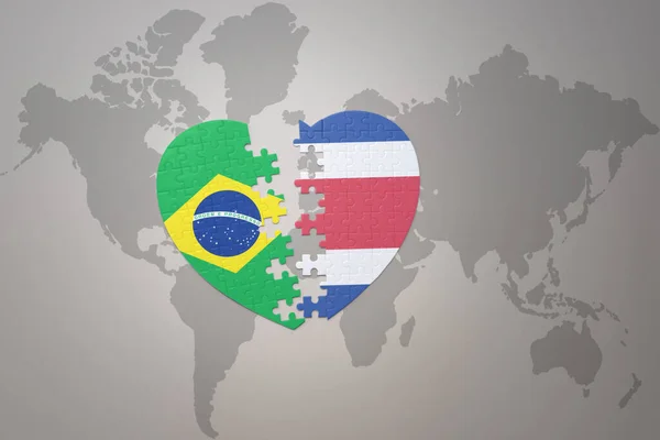Серце Головоломка Національним Прапором Бразилії Коста Рики Фоні Карти Світу — стокове фото