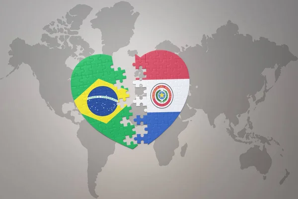 Серце Головоломка Національним Прапором Бразилії Парагваю Фоні Карти Світу Концепція — стокове фото
