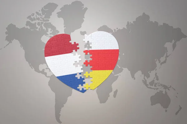 Puzzle Srdce Národní Vlajkou Jižní Osetie Podzemí Pozadí Světové Mapové — Stock fotografie
