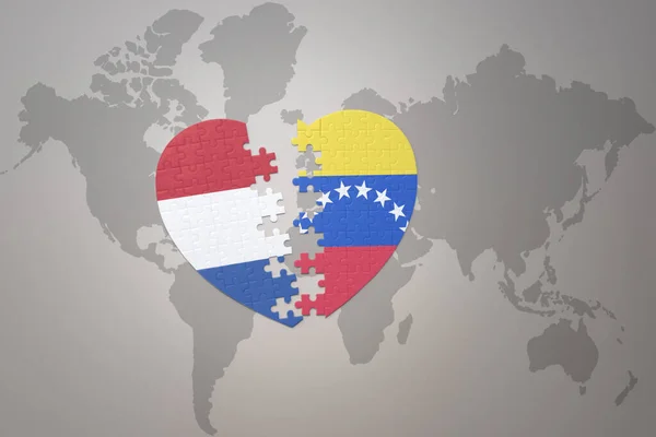 Puzzle Heart National Flag Venezuela Netherlands World Map Background Concept — Stock Photo, Image
