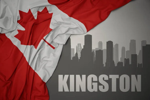 灰色の背景にカナダのカラフルな国旗を振って近くにキングストンのテキストと街の抽象的なシルエット — ストック写真