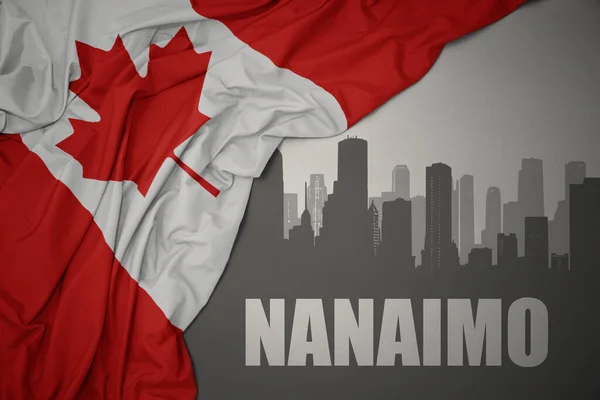 カナダのカラフルな国旗を灰色の背景に手を振っている七尾の街の抽象的なシルエット — ストック写真