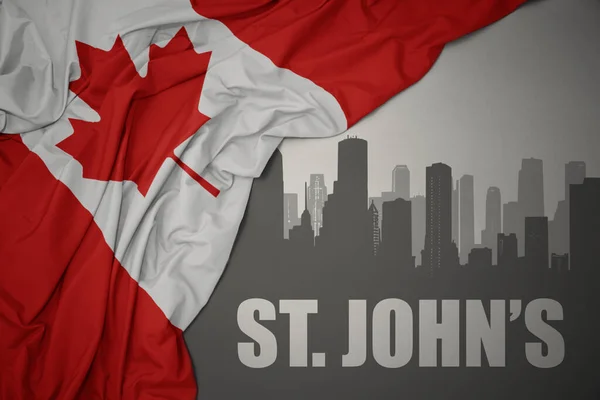 テキストのある街の抽象的なシルエットセントジョンズ近く灰色の背景にカナダのカラフルな国旗を振って — ストック写真