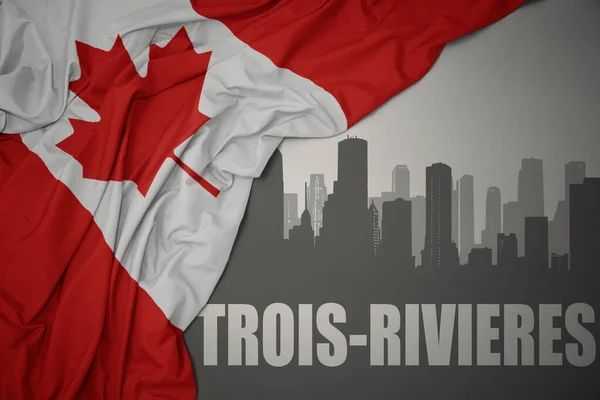 在灰色背景下 在色彩艳丽的加拿大国旗附近 三人组的文字勾勒出了这个城市的轮廓 — 图库照片