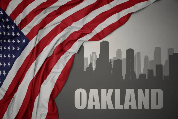 Amerika Birleşik Devletleri 'nin gri arka planında renkli bayrağını sallayan Oakland yazısıyla şehrin soyut silueti.