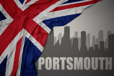 Şehrin soyut silueti. Portsmouth, gri bir arkaplanda büyük Britanya bayrağının dalgalandığı renkli bir yazı..