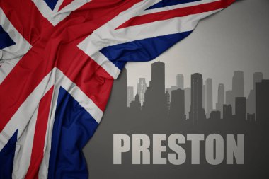 Şehrin soyut silueti, Preston 'ın gri bir arka planda büyük Britanya bayrağının yanında salladığı yazı..