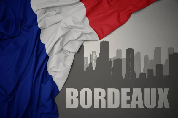 Silhueta Abstrata Cidade Com Texto Bordeaux Perto Acenando Colorido Bandeira — Fotografia de Stock