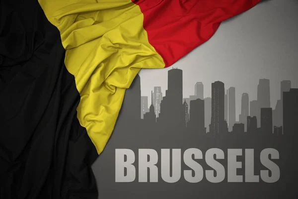 Абстрактный Силуэт Города Текстом Брюссель Возле Размахивания Красочным Национальным Флагом — стоковое фото