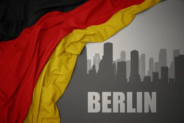 Silhueta Abstrata Cidade Com Texto Berlim Perto Acenando Colorido Bandeira — Fotografia de Stock