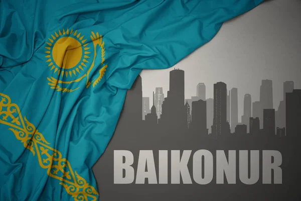Silhueta Abstrata Cidade Com Texto Baikonur Perto Acenar Bandeira Nacional — Fotografia de Stock