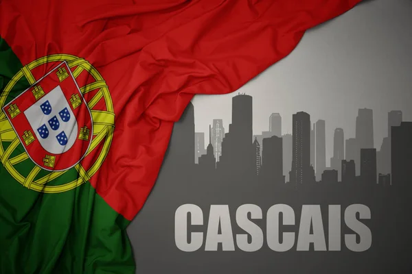 テキスト付き都市の抽象的なシルエット灰色の背景にポルトガルのカラフルな国旗を振って近くカスカイス — ストック写真