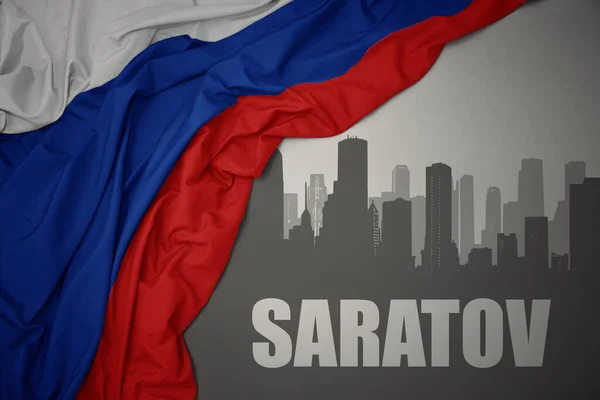 Silueta Abstracta Ciudad Con Texto Saratov Cerca Ondeando Colorida Bandera —  Fotos de Stock