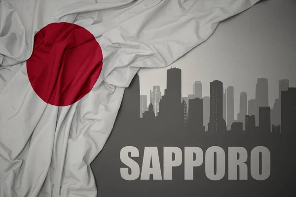 Japonya Nın Gri Arka Planında Renkli Bayrağını Sallayan Sapporo Yazısıyla — Stok fotoğraf