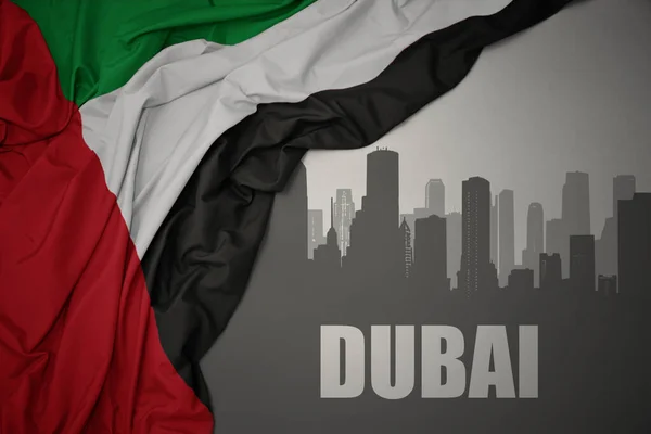 Silueta Abstracta Ciudad Con Texto Dubai Cerca Ondeando Colorida Bandera — Foto de Stock