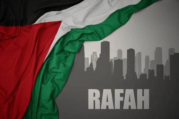 Silueta Abstracta Ciudad Con Texto Rafah Cerca Ondeando Colorida Bandera — Foto de Stock