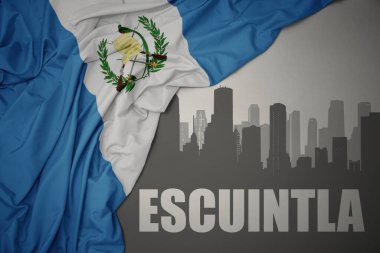 Escuintla 'nın gri arka planda renkli Guatemala bayrağı dalgalanması yakınındaki yazı ile şehrin soyut silueti. 3B illüstrasyon