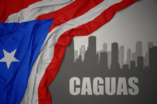 Abstrakcyjna Sylwetka Miasta Tekstem Caguas Pobliżu Machania Kolorowe Flagi Narodowej — Zdjęcie stockowe