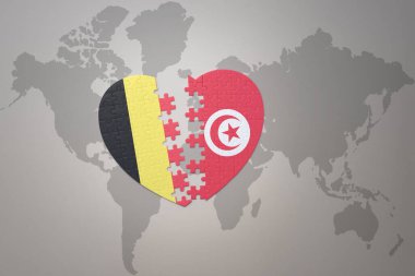 Bir dünya haritasında Belçika ve Tunus 'un ulusal bayrağıyla bulmaca kalbi. 3B illüstrasyon