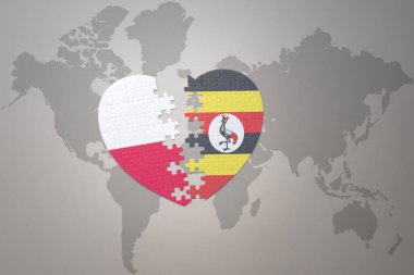 Uganda ve Polonya 'nın ulusal bayrağıyla bir dünya haritasında bulmaca kalbi. 3B illüstrasyon