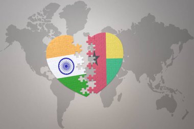 puzzle heart with the national flag of india and guinea bissau on a world map background.Concept. 3D illustration