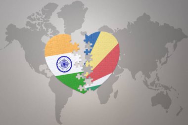 puzzle heart with the national flag of india and seychelles on a world map background.Concept. 3D illustration