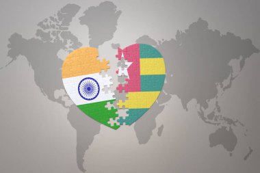 puzzle heart with the national flag of india and togo on a world map background.Concept. 3D illustration