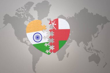 puzzle heart with the national flag of india and oman on a world map background.Concept. 3D illustration