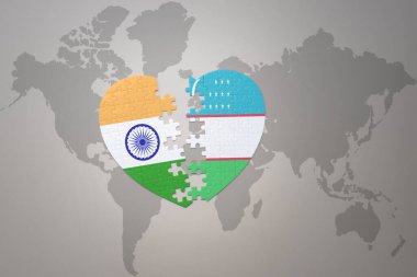 puzzle heart with the national flag of india and uzbekistan on a world map background.Concept. 3D illustration