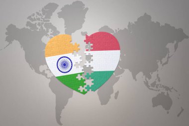 puzzle heart with the national flag of india and hungary on a world map background.Concept. 3D illustration