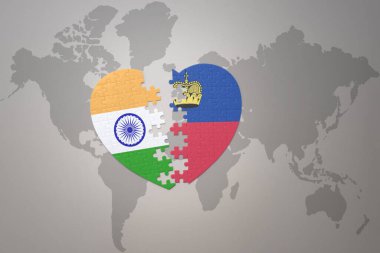 puzzle heart with the national flag of india and liechtenstein on a world map background.Concept. 3D illustration