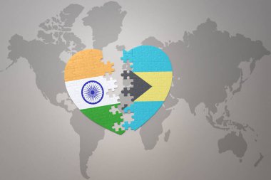 puzzle heart with the national flag of india and bahamas on a world map background.Concept. 3D illustration