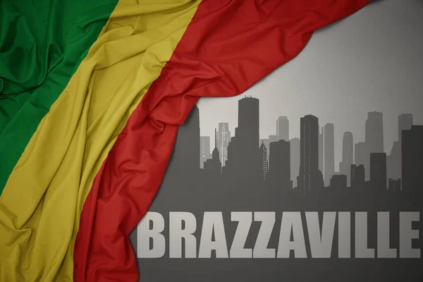 Silueta Abstracta Ciudad Con Texto Brazzaville Cerca Ondeando Colorida Bandera —  Fotos de Stock