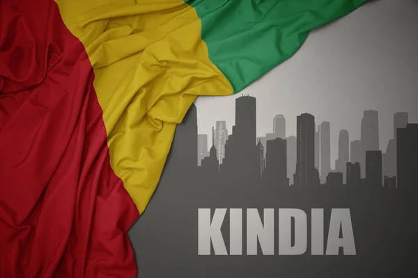 Abstract Silhouette City Text Kindia Waving Colorful National Flag Guinea —  Fotos de Stock