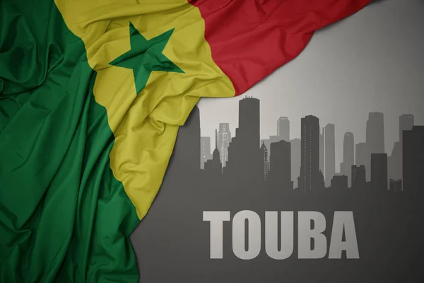 Abstract Silhouette City Text Touba Waving Colorful National Flag Senegal —  Fotos de Stock