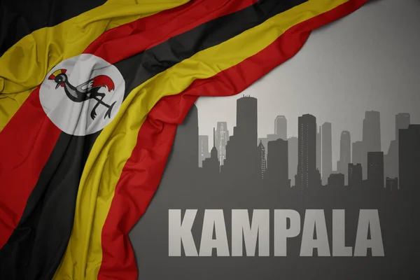 Abstrakcyjna Sylwetka Miasta Tekstem Kampala Pobliżu Machania Kolorowe Flagi Narodowej — Zdjęcie stockowe