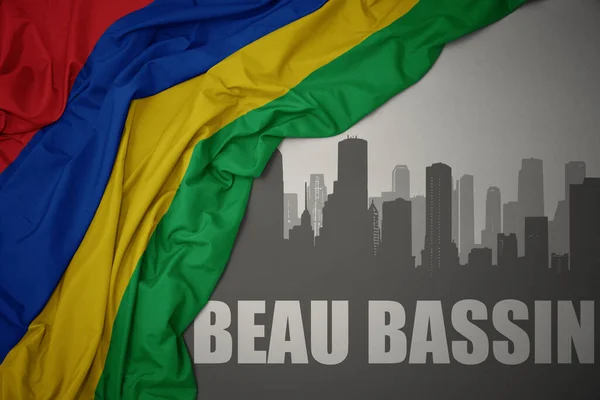 Abstract Silhouette City Text Beau Bassin Waving Colorful National Flag — стоковое фото