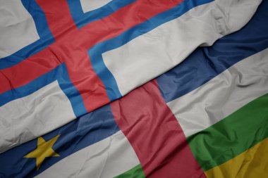 waving colorful flag of central african republic and national flag of faroe islands. macro.3d illustration