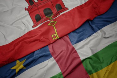 waving colorful flag of central african republic and national flag of gibraltar. macro.3d illustration
