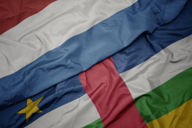 waving colorful flag of central african republic and national flag of luxembourg. macro.3d illustration