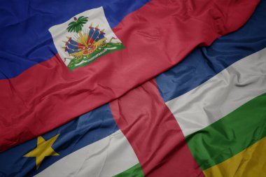 waving colorful flag of central african republic and national flag of haiti. macro.3d illustration